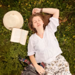 top-view-woman-grass_23-2148601928