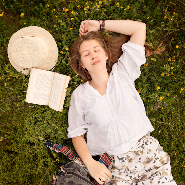 top-view-woman-grass_23-2148601928